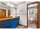 Stylish bathroom featuring double sinks, a wood countertop, and an adjacent toilet room at 4055 State Road 11, Deland, FL 32724