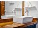 Close-up on bathroom double sink, featuring wood countertops, and simple, elegant design at 4055 State Road 11, Deland, FL 32724