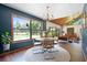 Open dining area with abundant light, modern table and chairs, creating an inviting space for Gathering meals and entertaining at 4055 State Road 11, Deland, FL 32724