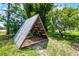 Triangular wooden storage structure on grassy lot at 4055 State Road 11, Deland, FL 32724
