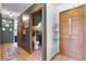 Hallway view showing interior doors, tile flooring, and decorative wall accents throughout at 4055 State Road 11, Deland, FL 32724