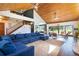 Spacious living area with high wood ceilings, large windows, and comfortable seating, offering an ideal space for relaxation at 4055 State Road 11, Deland, FL 32724