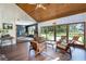 Bright living room with pool view, wood floors, and comfortable seating, creating a relaxing indoor/outdoor living experience at 4055 State Road 11, Deland, FL 32724
