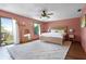 Spacious main bedroom boasting natural light, balcony access, and stylish decor at 4055 State Road 11, Deland, FL 32724