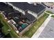 Aerial view of townhomes featuring private screened-in pools, and meticulously maintained landscaping at 4184 Paragraph Dr, Kissimmee, FL 34746