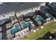Overhead view highlighting the private pools and screened-in patios of the townhome community at 4184 Paragraph Dr, Kissimmee, FL 34746
