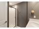 Bathroom features a modern shower with glass door and sleek fixtures at 4184 Paragraph Dr, Kissimmee, FL 34746