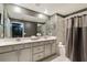 Bathroom featuring double sinks, a large mirror, and a shower-tub combination at 4184 Paragraph Dr, Kissimmee, FL 34746