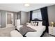 Bedroom featuring dark accents, a comfortable bed, and lots of light at 4184 Paragraph Dr, Kissimmee, FL 34746