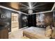 A themed bedroom with a unique ceiling and a view into the bathroom at 4184 Paragraph Dr, Kissimmee, FL 34746