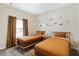 Cozy bedroom with twin beds and gallery wall for a personal touch at 4184 Paragraph Dr, Kissimmee, FL 34746
