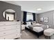 Well-appointed bedroom with stylish decor, comfortable bed, and ample natural light at 4184 Paragraph Dr, Kissimmee, FL 34746