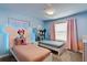 Unique bedroom with two twin beds featuring custom Mickey Mouse headboards at 4184 Paragraph Dr, Kissimmee, FL 34746