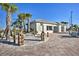 A beachy exterior featuring a bright white building, palm trees, hammocks, and other resort style details at 4184 Paragraph Dr, Kissimmee, FL 34746