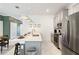 Contemporary kitchen featuring stainless steel appliances, pendant lights, and sleek countertops at 4184 Paragraph Dr, Kissimmee, FL 34746