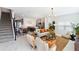 Open-concept living area features a modern design, stylish furnishings, and easy access to the kitchen at 4184 Paragraph Dr, Kissimmee, FL 34746