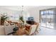Bright living room with sliding glass doors, plush seating, and views of the private pool at 4184 Paragraph Dr, Kissimmee, FL 34746