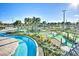 A picturesque mini golf course with a lazy river, creating an idyllic recreational space at 4184 Paragraph Dr, Kissimmee, FL 34746