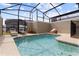Relaxing screened-in pool area with comfortable lounge furniture and ample sunlight at 4184 Paragraph Dr, Kissimmee, FL 34746