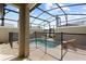 Private screened-in pool area with comfortable lounge furniture and secure safety fencing at 4184 Paragraph Dr, Kissimmee, FL 34746