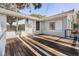 Spacious deck outside the home with natural lighting and striped wooden flooring at 465 W Lakeshore Dr, Clermont, FL 34711