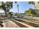 Wide-open backyard deck area with wood flooring and steel railings at 465 W Lakeshore Dr, Clermont, FL 34711