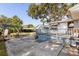 Comfortable backyard lounge and patio area with an outdoor grill at 465 W Lakeshore Dr, Clermont, FL 34711