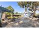 Clean backyard area with a detached garage and comfortable outdoor seating at 465 W Lakeshore Dr, Clermont, FL 34711