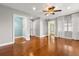 Bright bedroom with hardwood floors, several closets, and ample natural light at 465 W Lakeshore Dr, Clermont, FL 34711