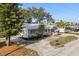 Charming single-story home featuring a metal roof, well-kept landscaping, and a welcoming front porch at 465 W Lakeshore Dr, Clermont, FL 34711