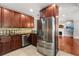 Well-lit kitchen with stainless steel appliances and granite countertops at 465 W Lakeshore Dr, Clermont, FL 34711
