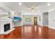 Inviting living room featuring hardwood floors, recessed lighting, a fireplace, and a view of the front door at 465 W Lakeshore Dr, Clermont, FL 34711