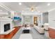 Bright living room with a decorative fireplace, recessed lighting, and hardwood floors creates an inviting atmosphere at 465 W Lakeshore Dr, Clermont, FL 34711
