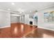 Spacious living area featuring hardwood floors and lots of natural light creates a warm and inviting atmosphere at 465 W Lakeshore Dr, Clermont, FL 34711