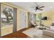 Inviting living room with hardwood floors, bright windows, and neutral furniture at 465 W Lakeshore Dr, Clermont, FL 34711