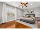 Tastefully decorated main bedroom with hardwood floors, ceiling fan, and modern furnishings at 465 W Lakeshore Dr, Clermont, FL 34711