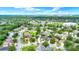 Aerial view of property in residential neighborhood with tree coverage at 4756 Fiske Cir, Orlando, FL 32826