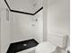 Bathroom features a tiled walk-in shower with black accents and a modern toilet at 4756 Fiske Cir, Orlando, FL 32826