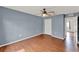 Bedroom with ceiling fan, closet, and hardwood floors at 4756 Fiske Cir, Orlando, FL 32826