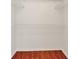 A walk-in closet with a wood floor and white shelving at 4756 Fiske Cir, Orlando, FL 32826