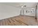 Open living room with wood-style floors, recessed lighting, and multiple entryways at 4756 Fiske Cir, Orlando, FL 32826