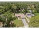 Aerial view of the home surrounded by lush trees at 4770 Drummond Ln, Orlando, FL 32810