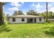 Exterior rear view of home showing the patio and backyard at 4770 Drummond Ln, Orlando, FL 32810