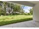 Expansive backyard featuring lawn and partial clearing at 4770 Drummond Ln, Orlando, FL 32810