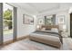 This spacious bedroom is illuminated with natural light and is highlighted by modern decor at 4770 Drummond Ln, Orlando, FL 32810