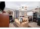 Fun bedroom featuring carpeted floors, a ceiling fan, and a loveseat for a relaxing and playful atmosphere at 493 Princewood Dr, Deland, FL 32724