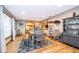 Open dining room featuring a wooden table, chairs, and cabinet with hardwood floors at 493 Princewood Dr, Deland, FL 32724