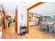 Hallway with view to dining room, fireplace, and living area with wood floors at 493 Princewood Dr, Deland, FL 32724
