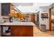Spacious kitchen with wooden cabinets, stainless steel appliances, and ample counter space at 493 Princewood Dr, Deland, FL 32724