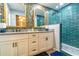 Bathroom with a granite topped vanity with double sinks, striking wallpaper and a bright tiled walk-in shower at 4963 Hoperita St, Orlando, FL 32812